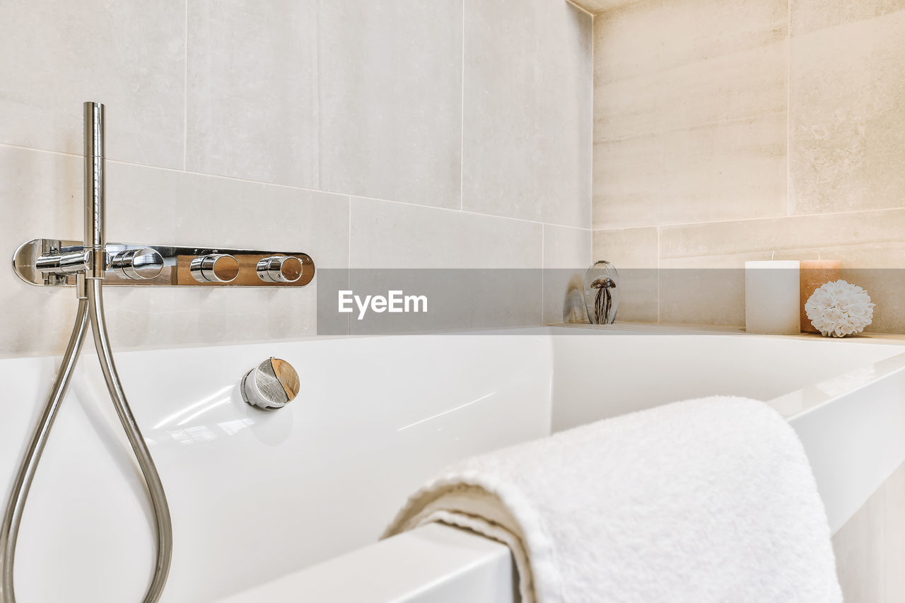 Close-up of faucet in bathroom