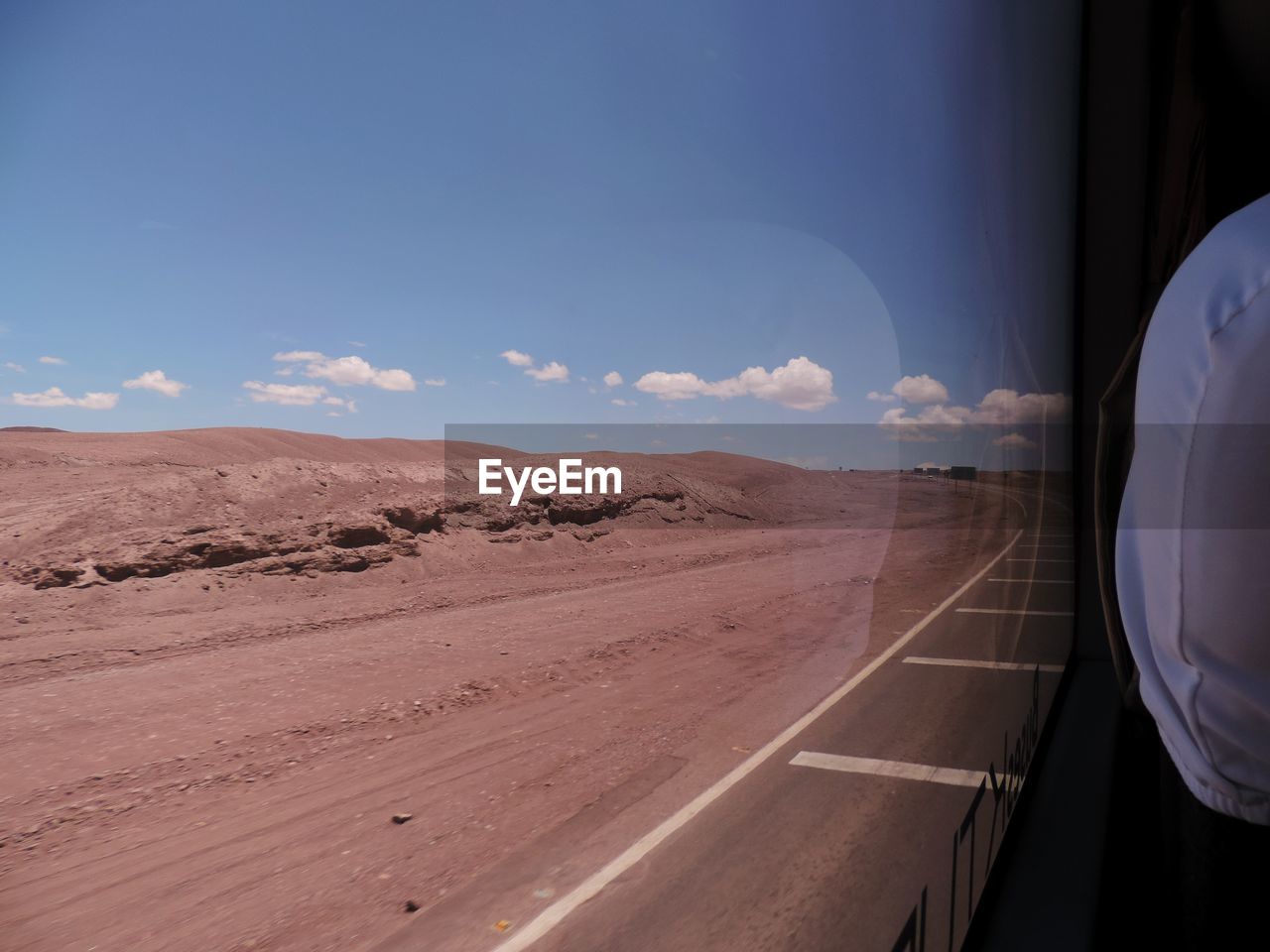 VIEW OF DESERT ROAD AGAINST SKY