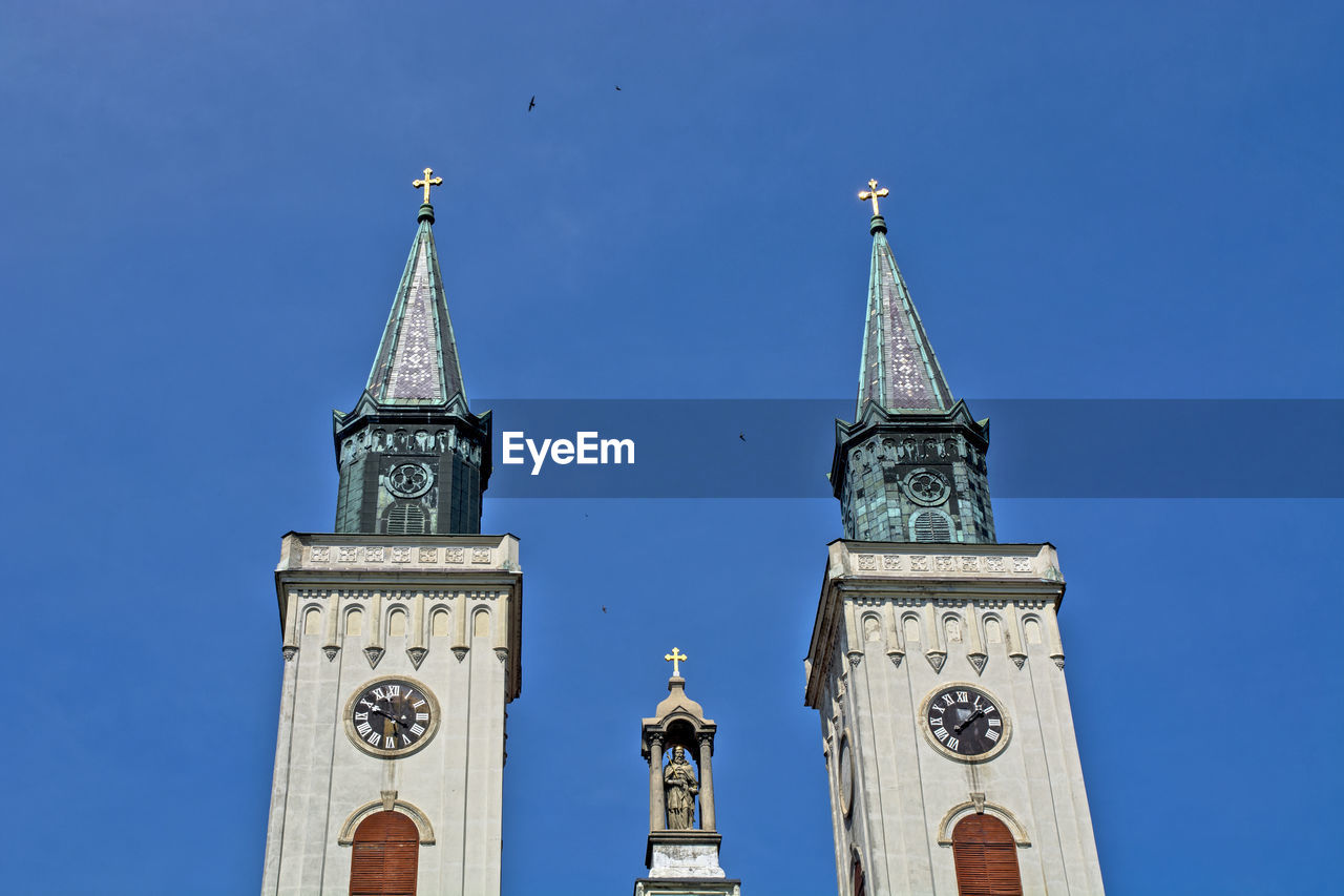  catholic church low angle view of clock tower against sky