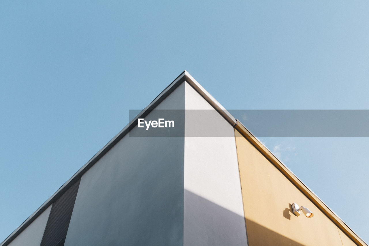 Low angle view of building against sky during sunny day