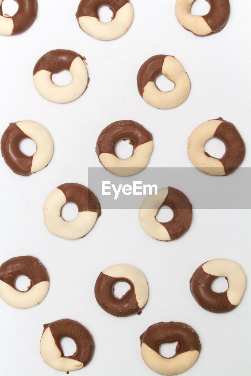 Directly above view of donuts against white background