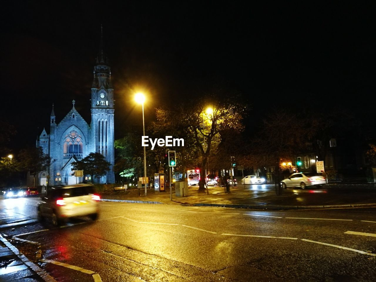 VIEW OF ILLUMINATED CITY AT NIGHT