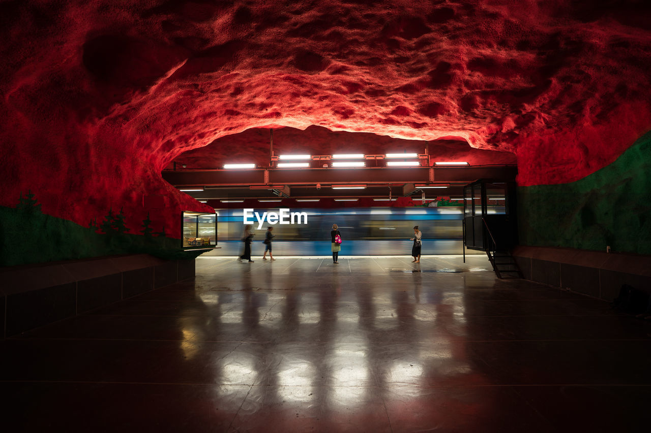 Illuminated subway tunnel at subway station