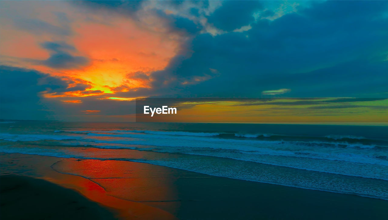 SCENIC VIEW OF SEA AGAINST ORANGE SKY