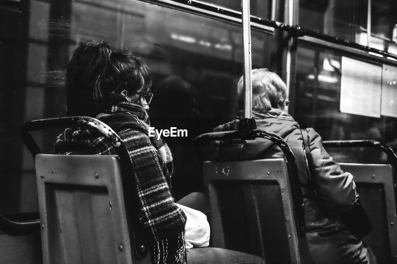 Women sitting in bus at night