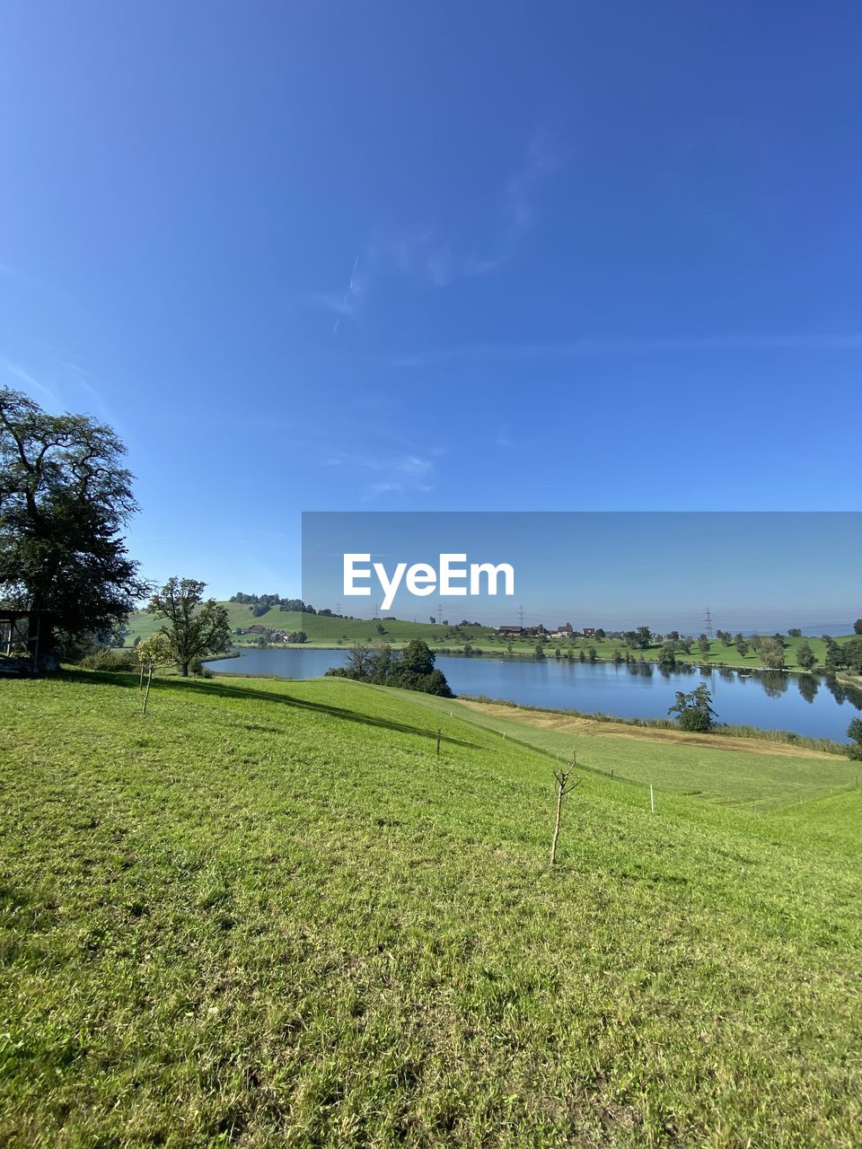 SCENIC VIEW OF LANDSCAPE AGAINST BLUE SKY