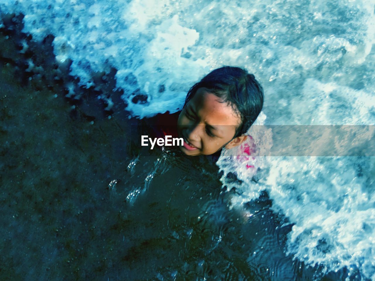 High angle view of girl swimming in sea