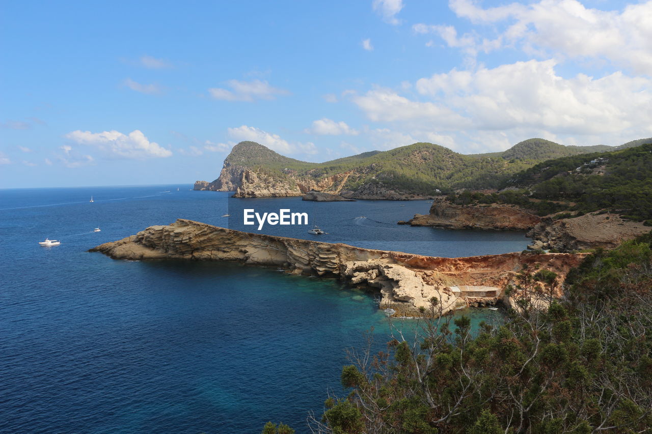 Scenic view of sea against cloudy sky