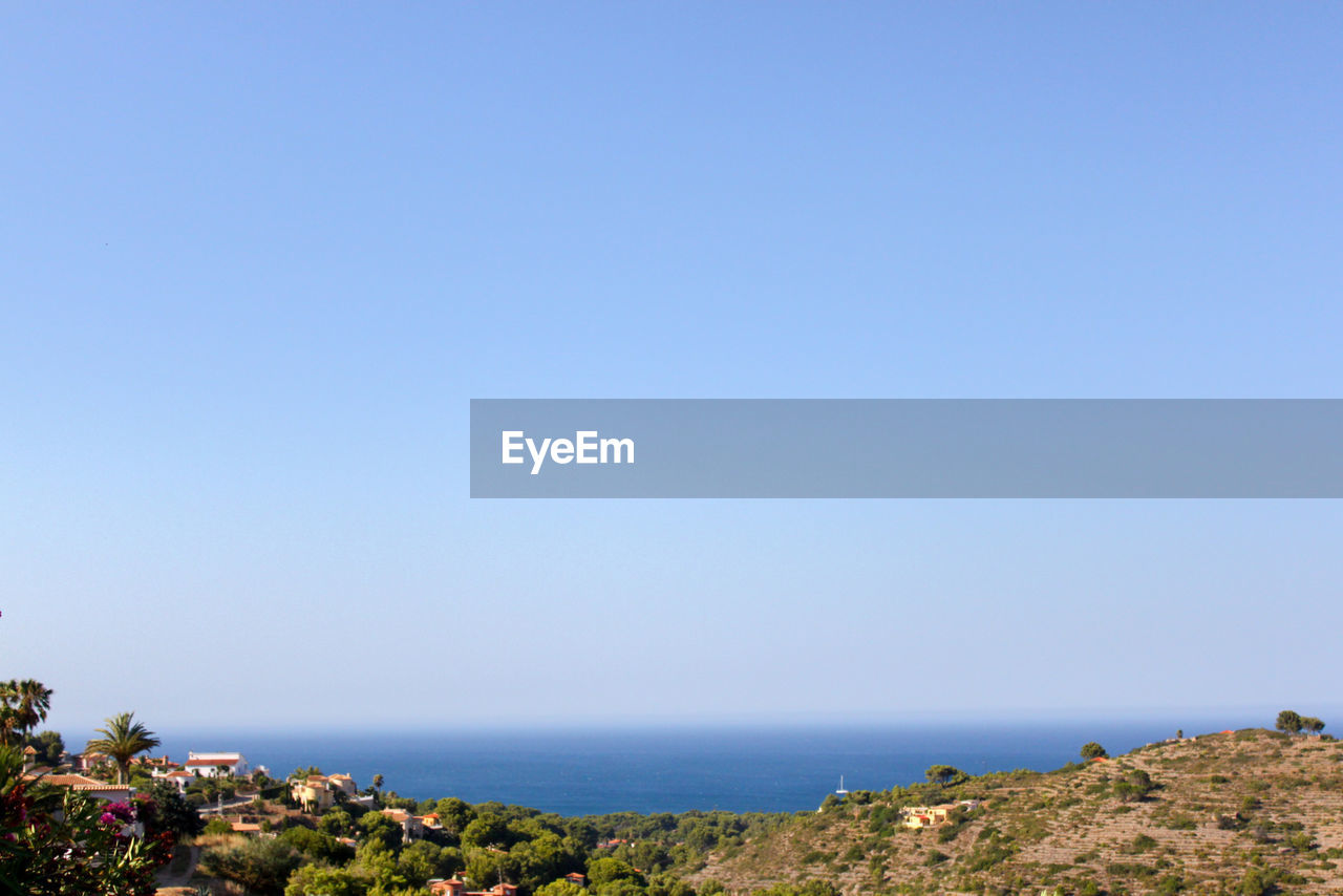 SCENIC VIEW OF BLUE SEA AGAINST CLEAR SKY