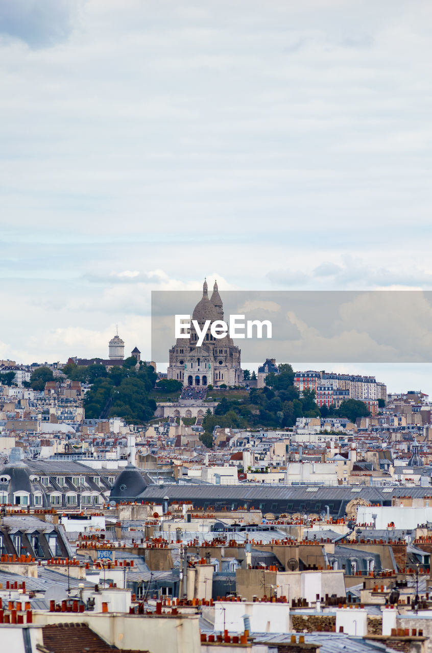 Paris cityscape from above. montmartre hill and sacre coer church stand out in the view