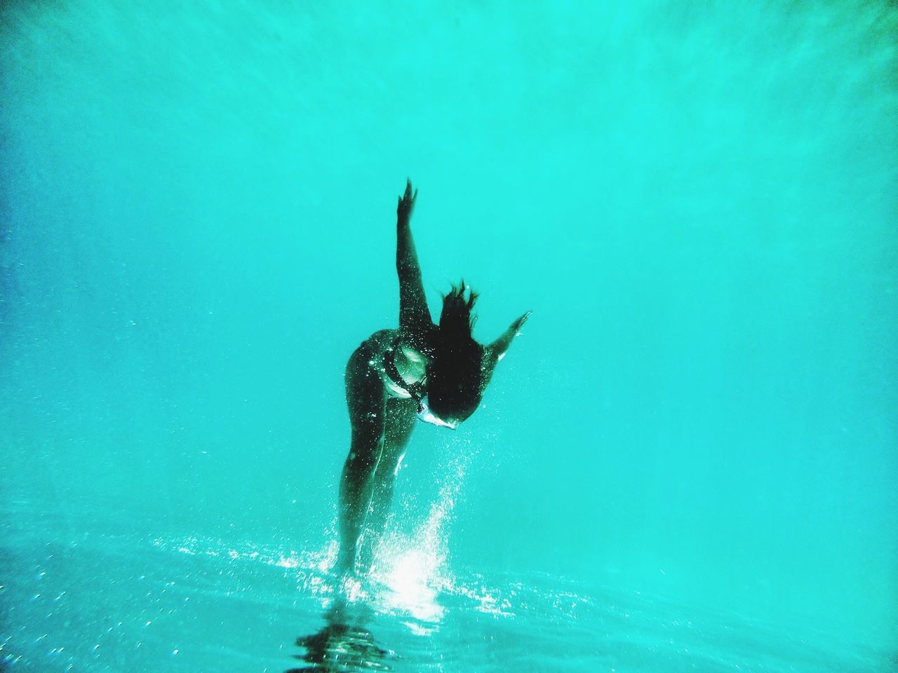 Full length of woman scuba diving in sea