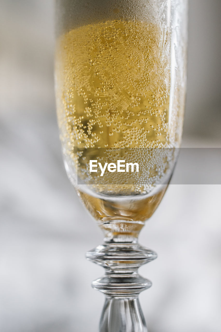 Close up of foamy champagne in flute glass