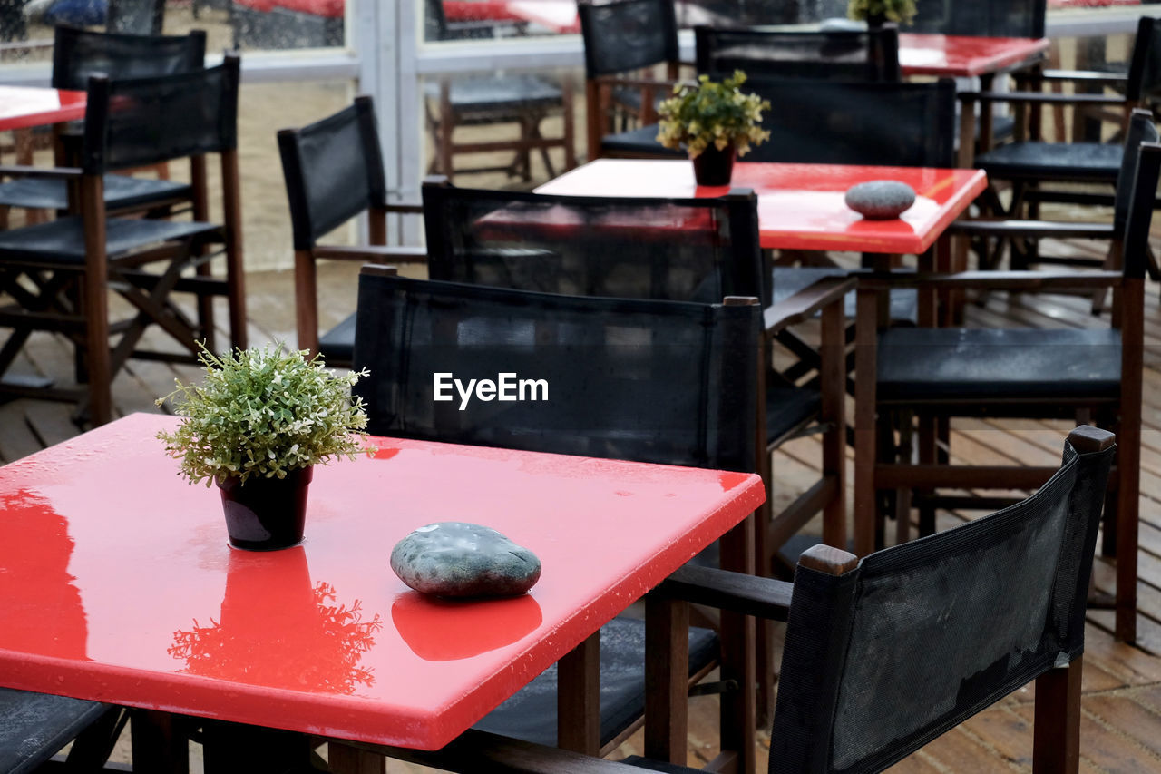 Empty chairs and tables at cafe