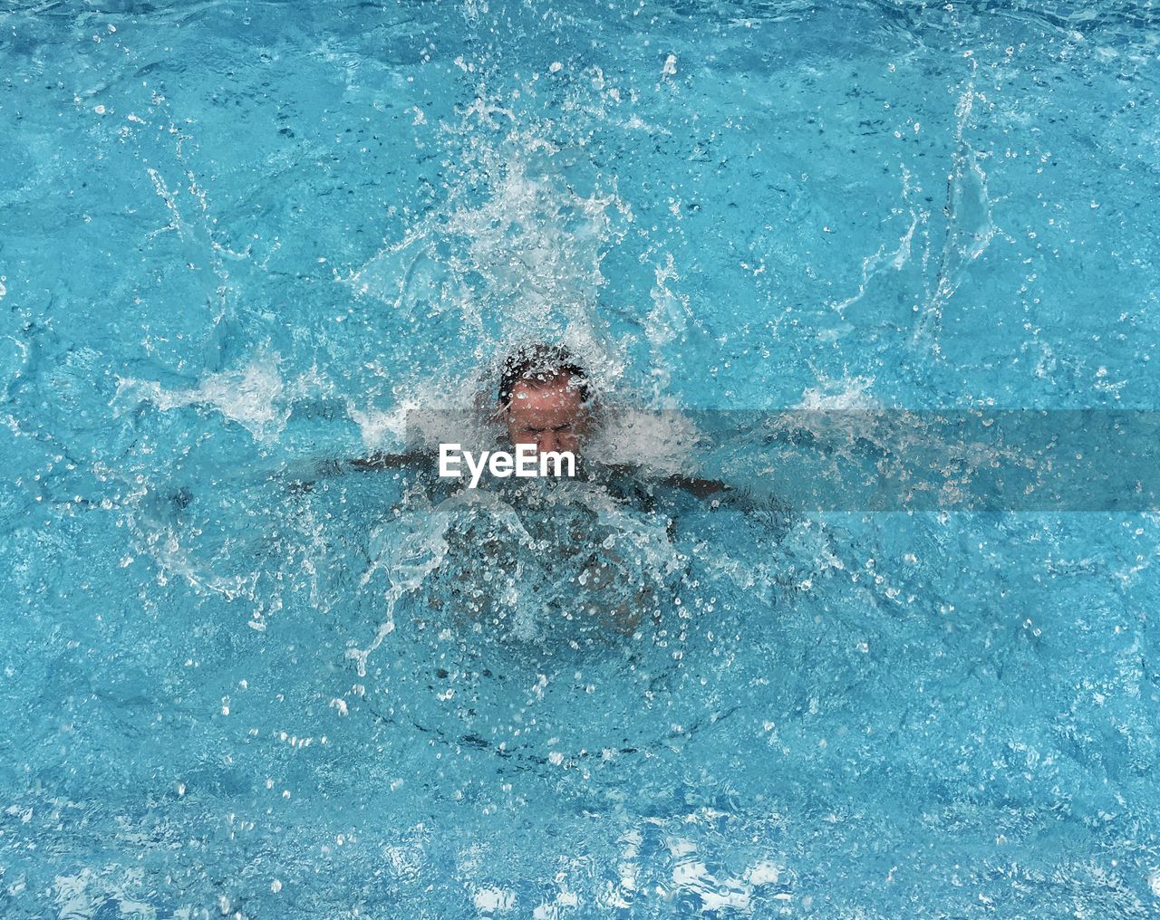 High angle view of man swimming in pool