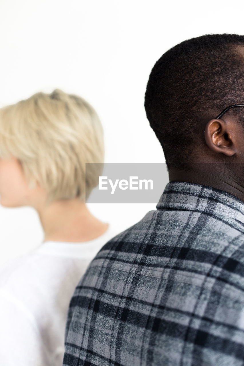 Rear view of couple against white background