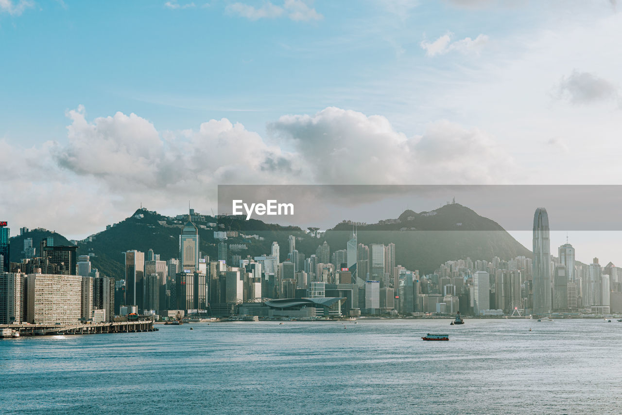 PANORAMIC VIEW OF SEA AND CITY BUILDINGS AGAINST SKY