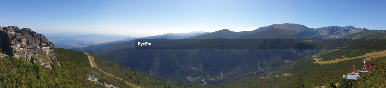 Scenic view of mountains against clear sky