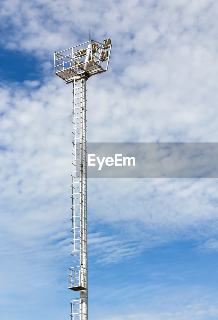 Low angle view of communications tower against sky