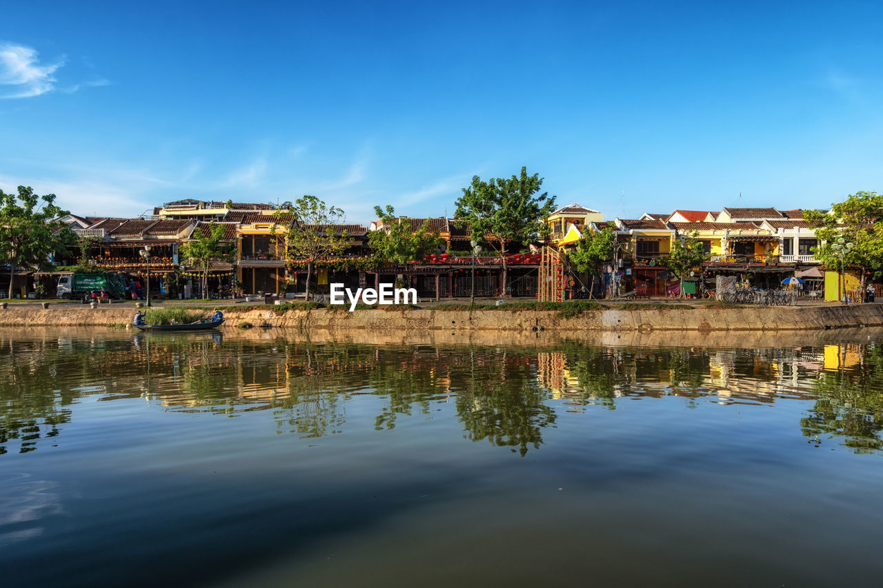 Thu bon river and an hoi town reflection taken from hoi an ancient town river bank.