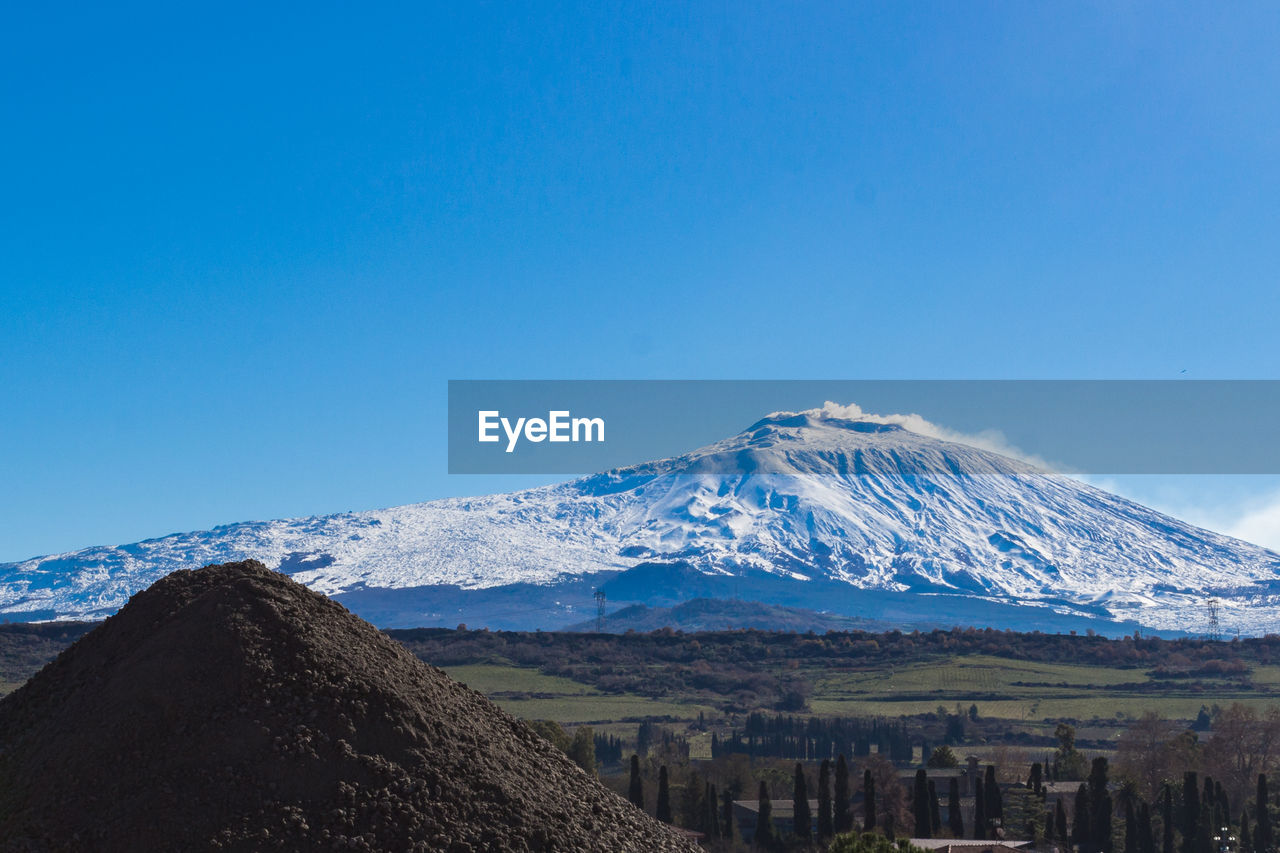 View of volcano etna from a small sicilian village