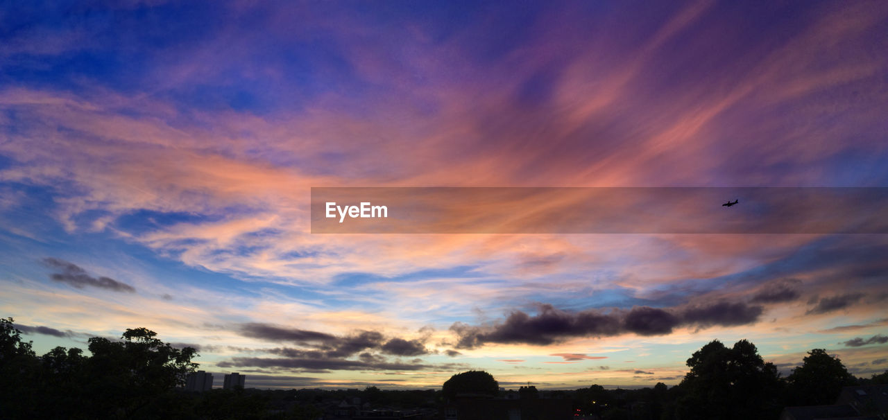 Low angle view of cloudy sky during sunset