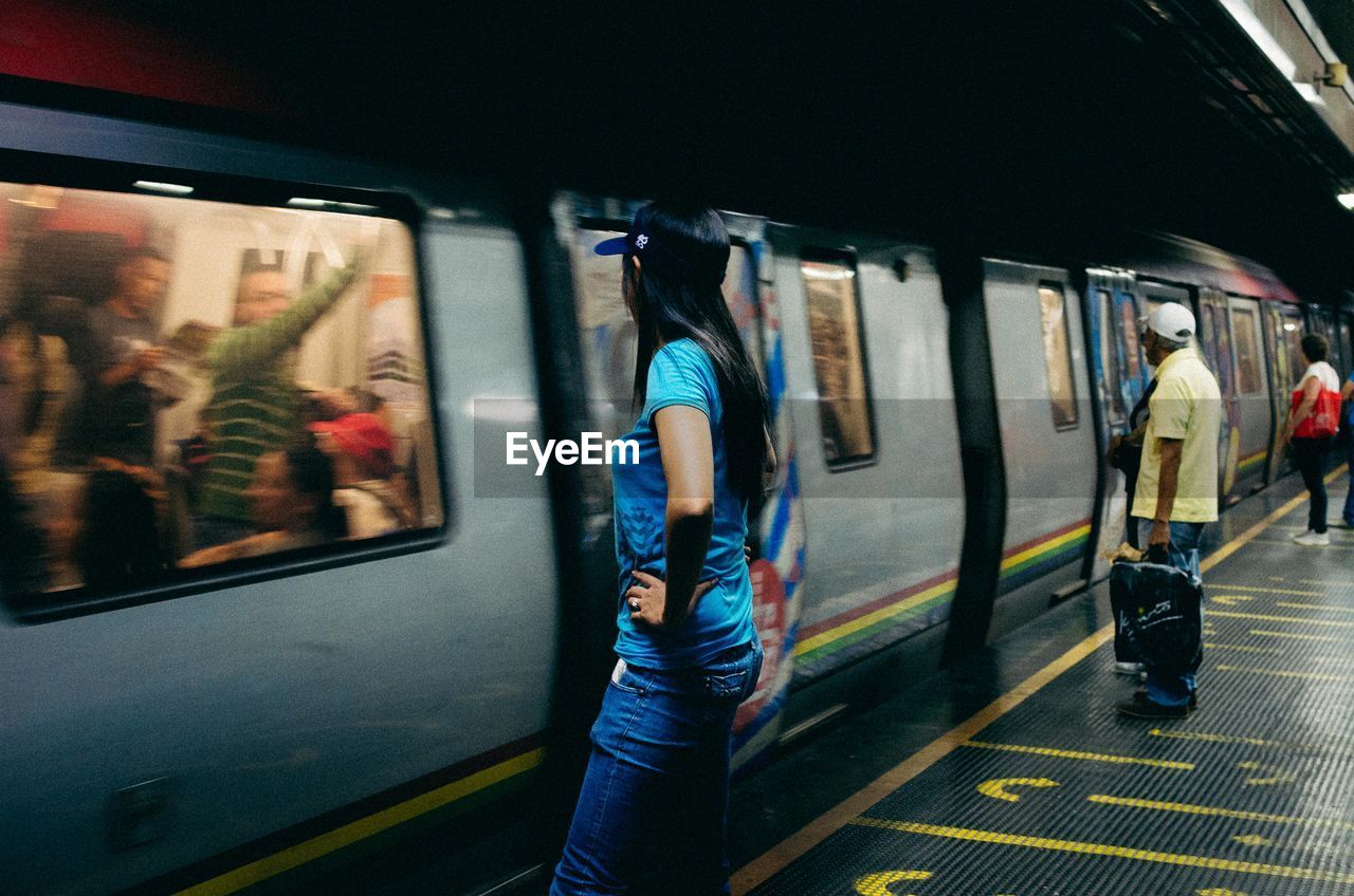 PEOPLE AT RAILROAD STATION PLATFORM