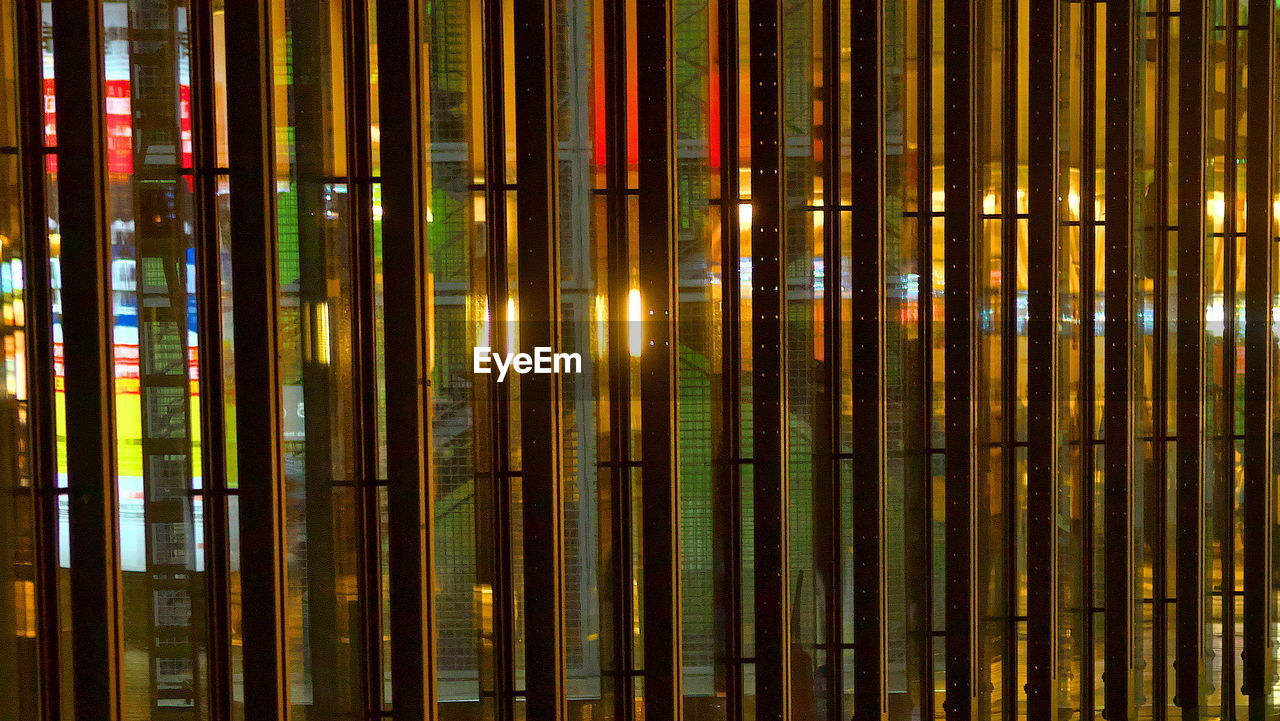 Close-up of multicoloured vertical lines of a facade