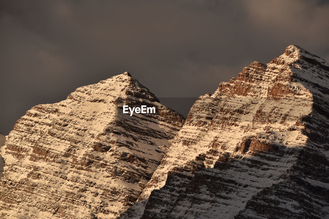 Low angle view of rock formation against sky