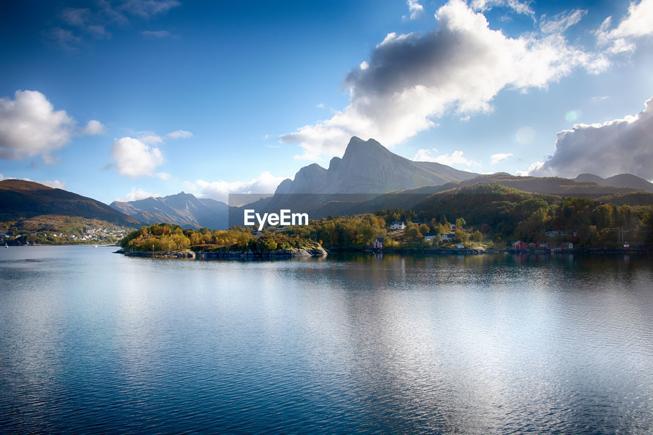 mountain, reflection, water, sky, scenics - nature, lake, beauty in nature, mountain range, nature, landscape, environment, cloud, body of water, tranquility, tranquil scene, morning, dusk, land, no people, travel destinations, travel, reservoir, tree, blue, outdoors, forest, idyllic, horizon, plant, mountain peak, tourism, day, non-urban scene, architecture, holiday