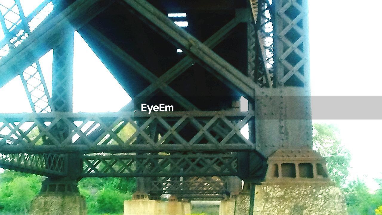 LOW ANGLE VIEW OF BRIDGE WITH BRIDGE