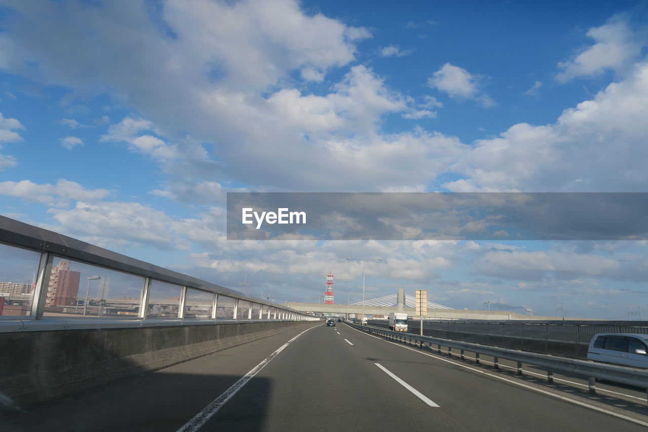 Bridge over road against sky