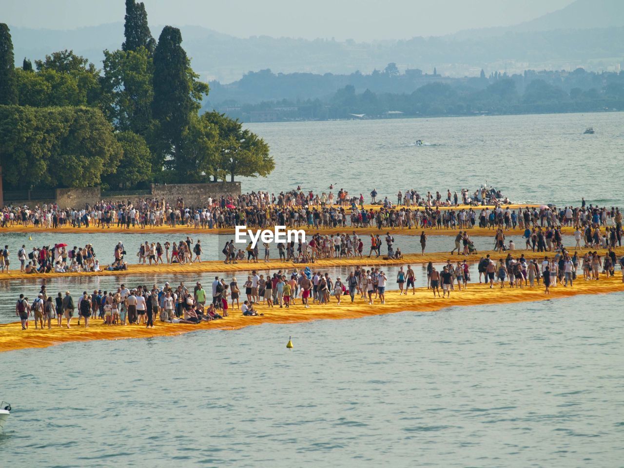 People on piers in sea