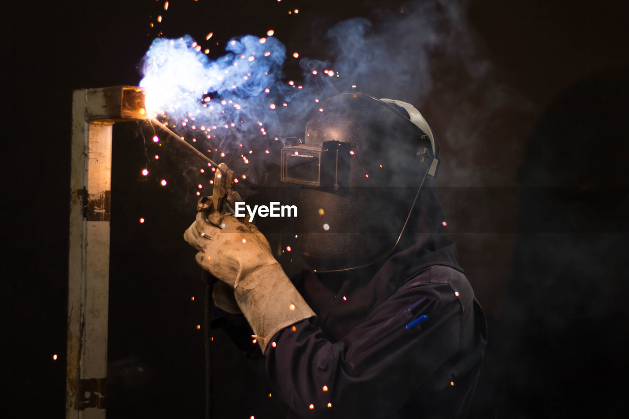 Man working on metal in workshop