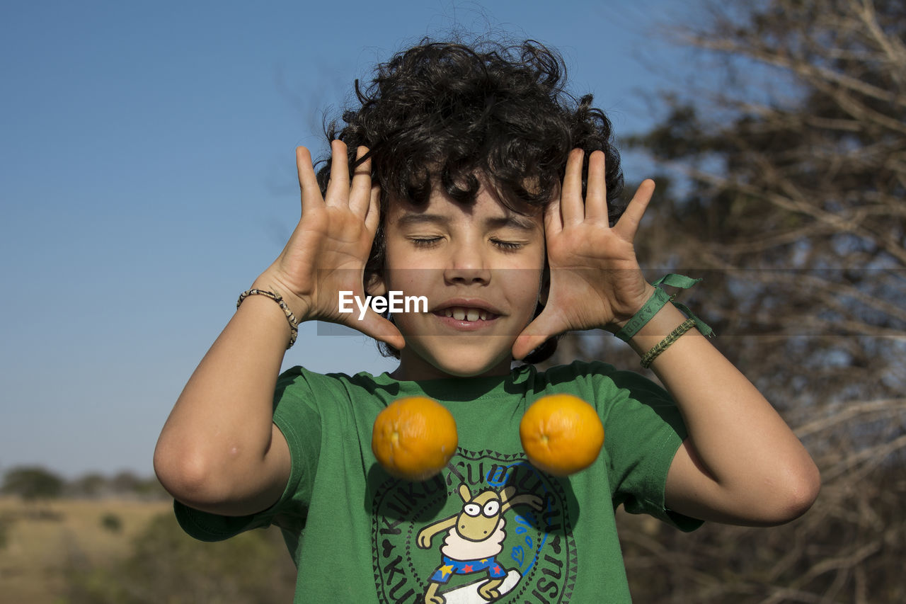 Boy playing outdoors