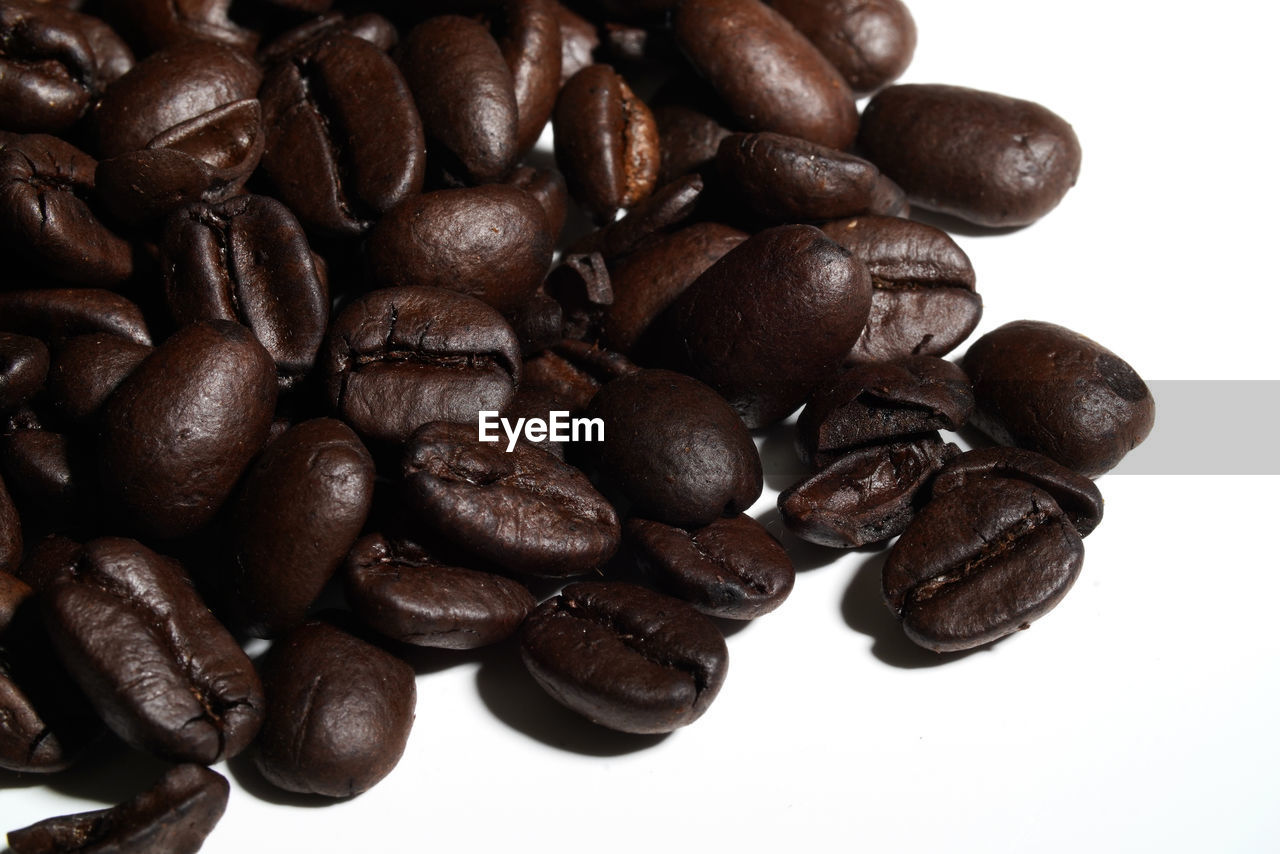 CLOSE-UP OF COFFEE BEANS IN BACKGROUND