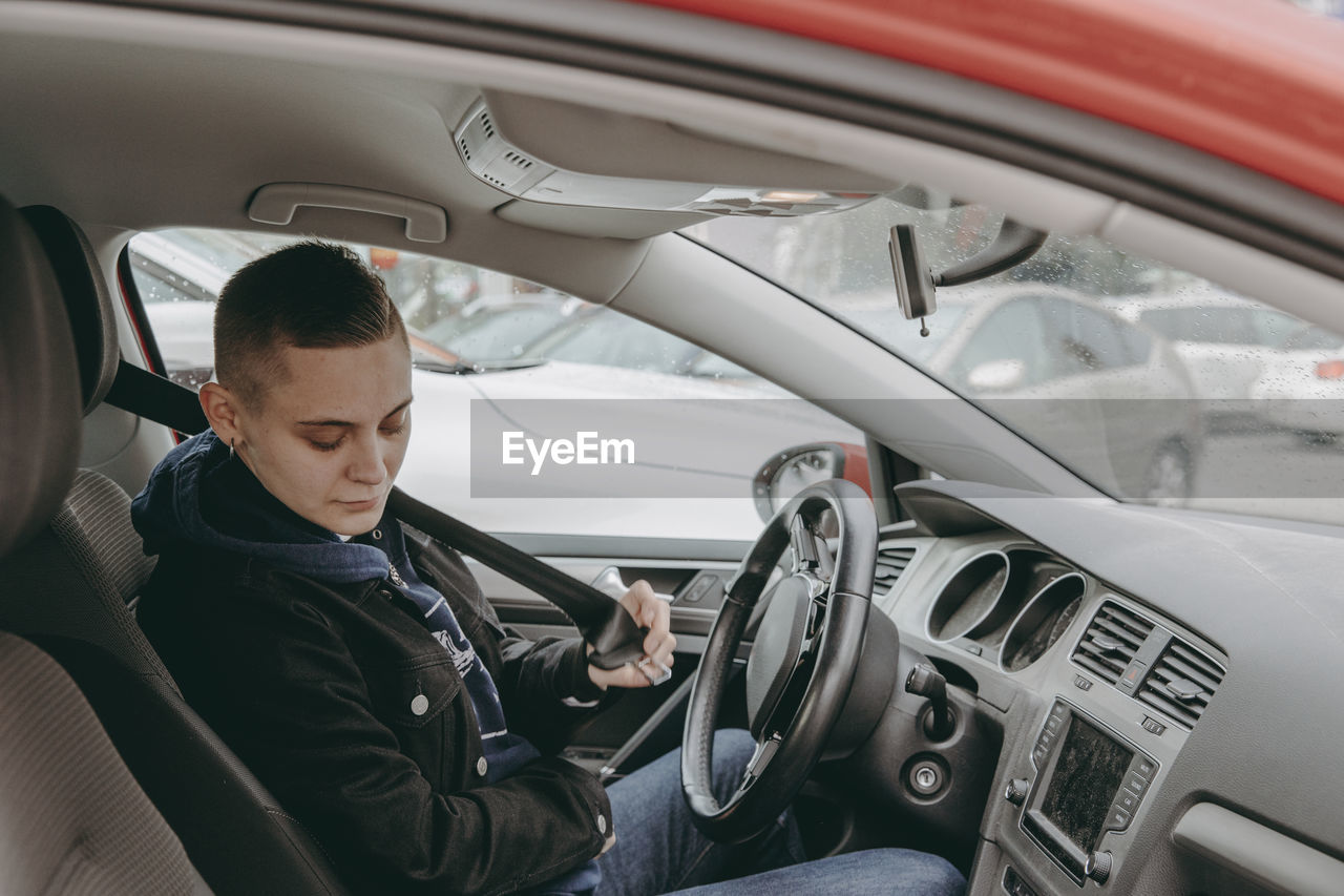 Woman sitting in car