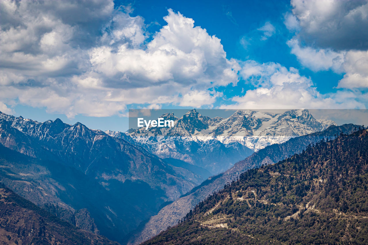 Himalaya mountain valley with bright blue sky at day from hilltop