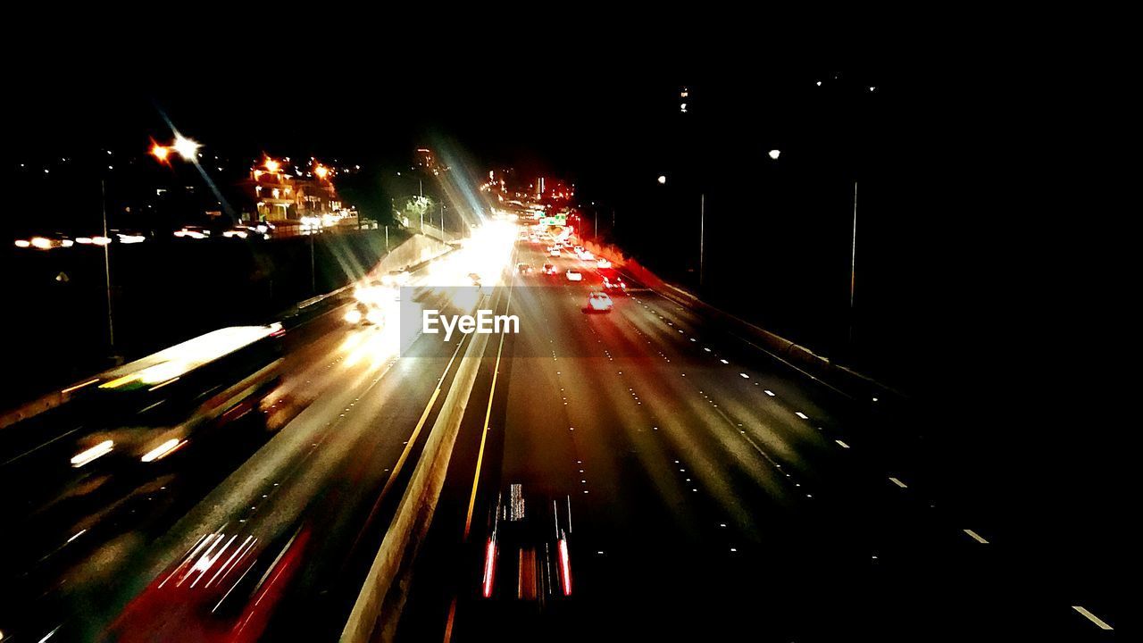 Blurred motion of cars moving on road at night