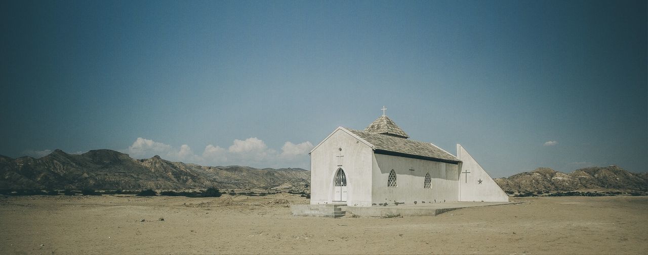 VIEW OF BUILT STRUCTURE AGAINST BLUE SKY