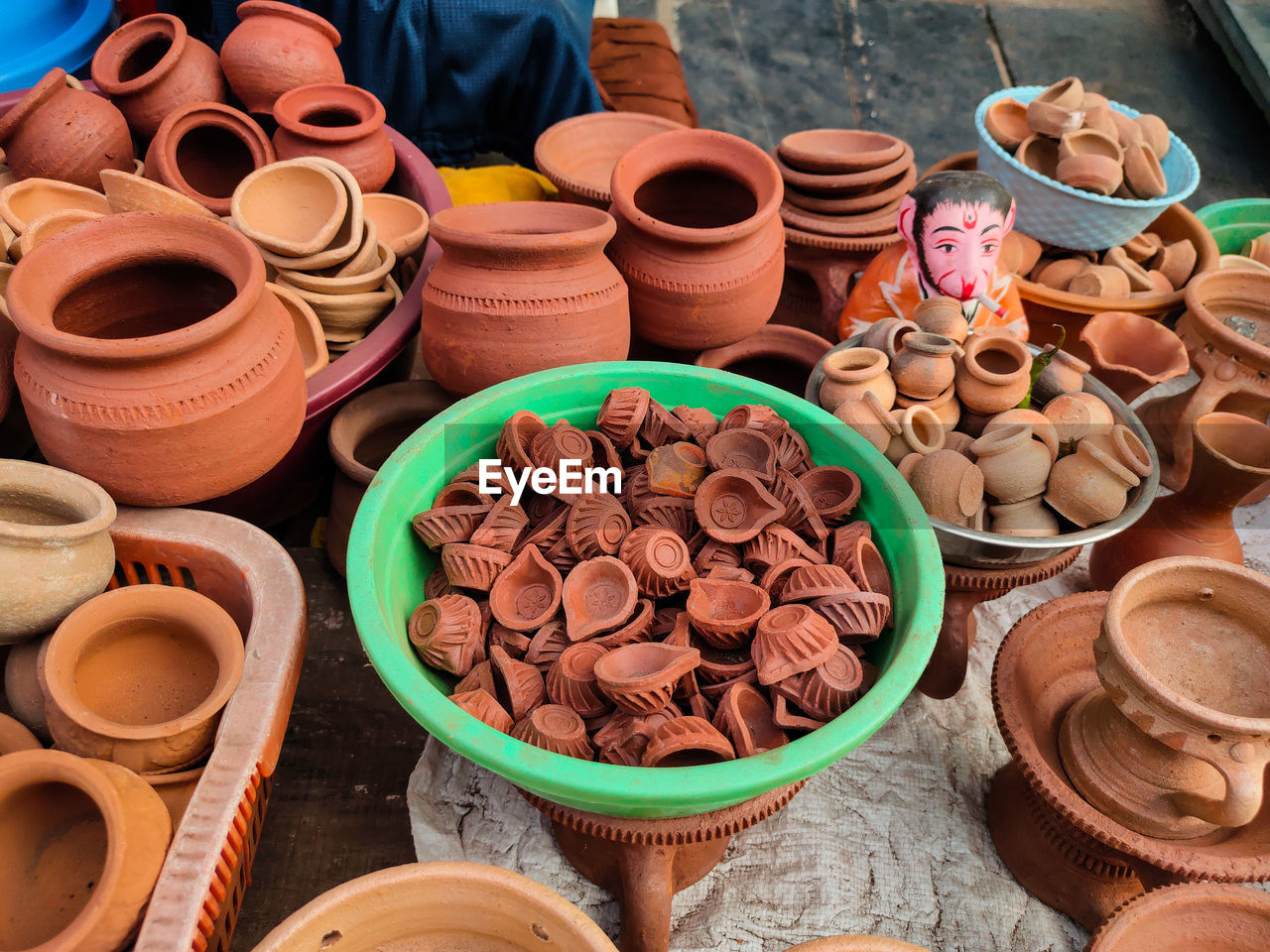 High angle view of various earthenware for sale at market