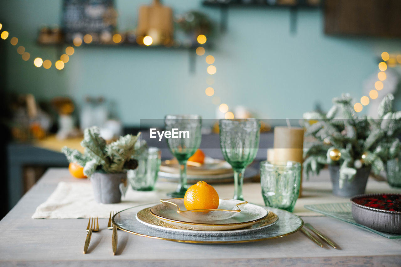 Table served for christmas dinner in living room