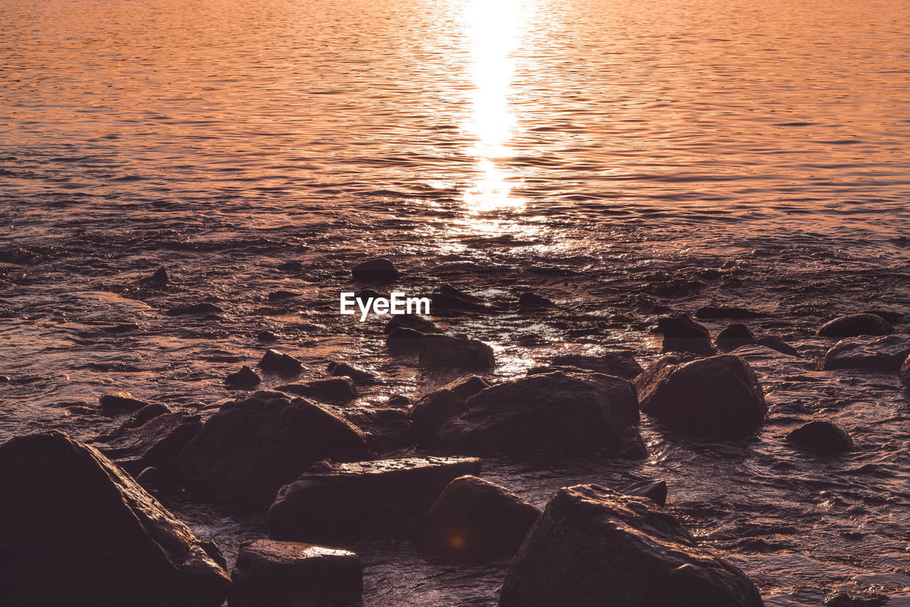 Aerial view of sea during sunset