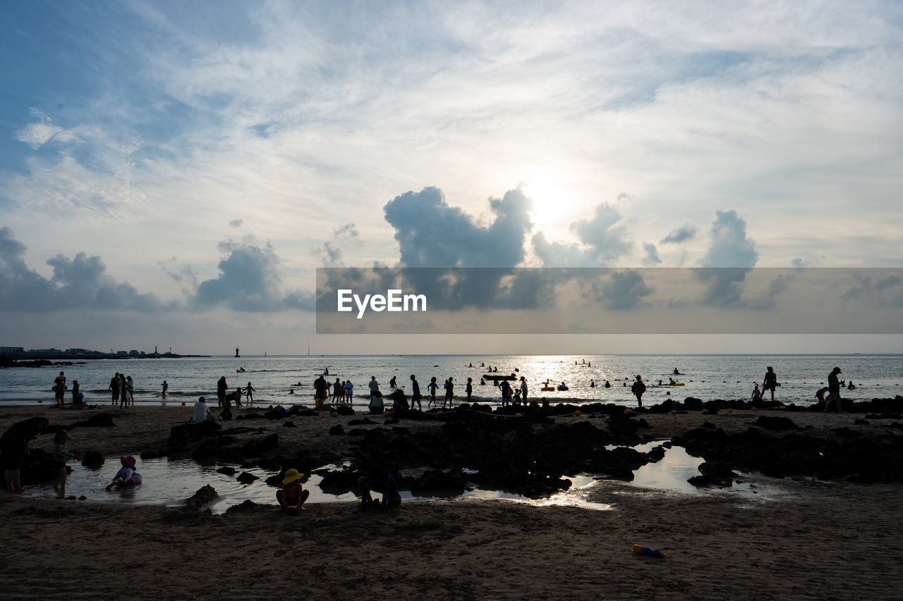 GROUP OF PEOPLE ON BEACH