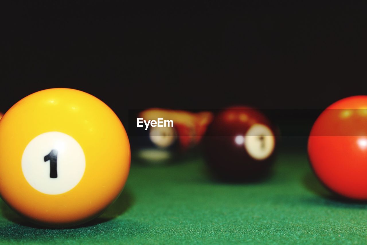 Close-up of pool balls on pool table