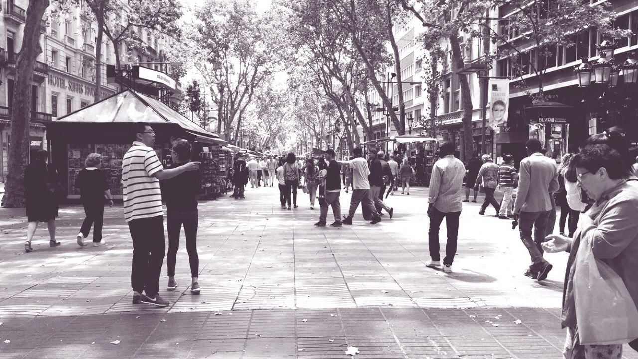 PEOPLE WALKING ON CITY STREET