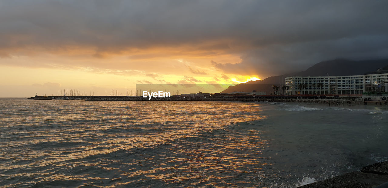 Scenic view of sea against sky during sunset