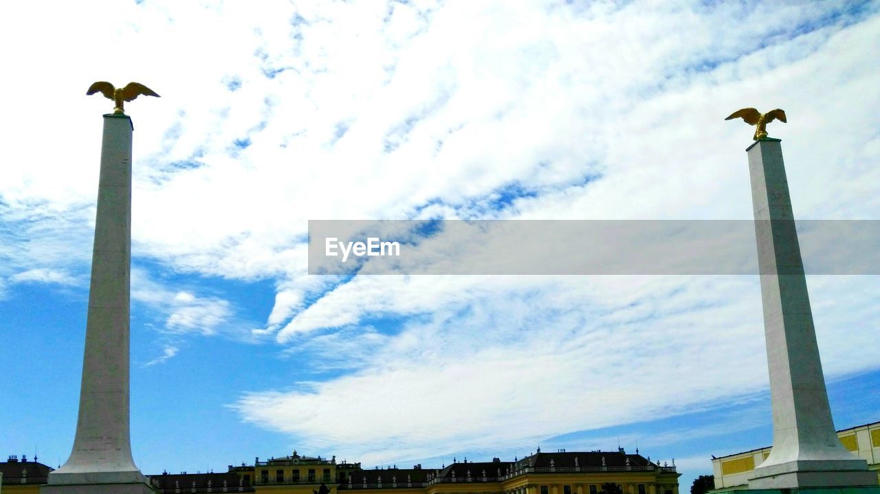 LOW ANGLE VIEW OF STATUES AGAINST SKY