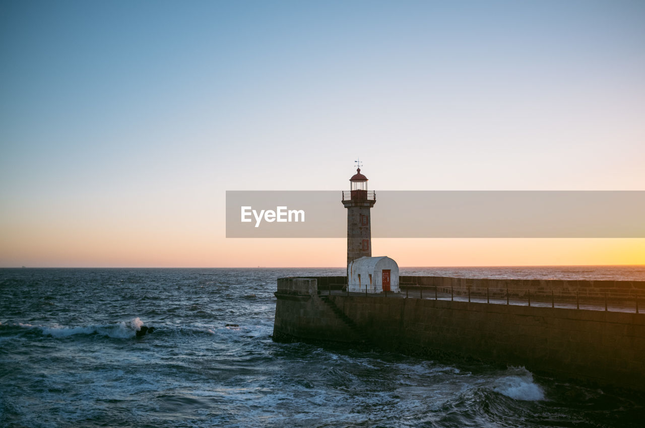 Scenic view of lighthouse on pier