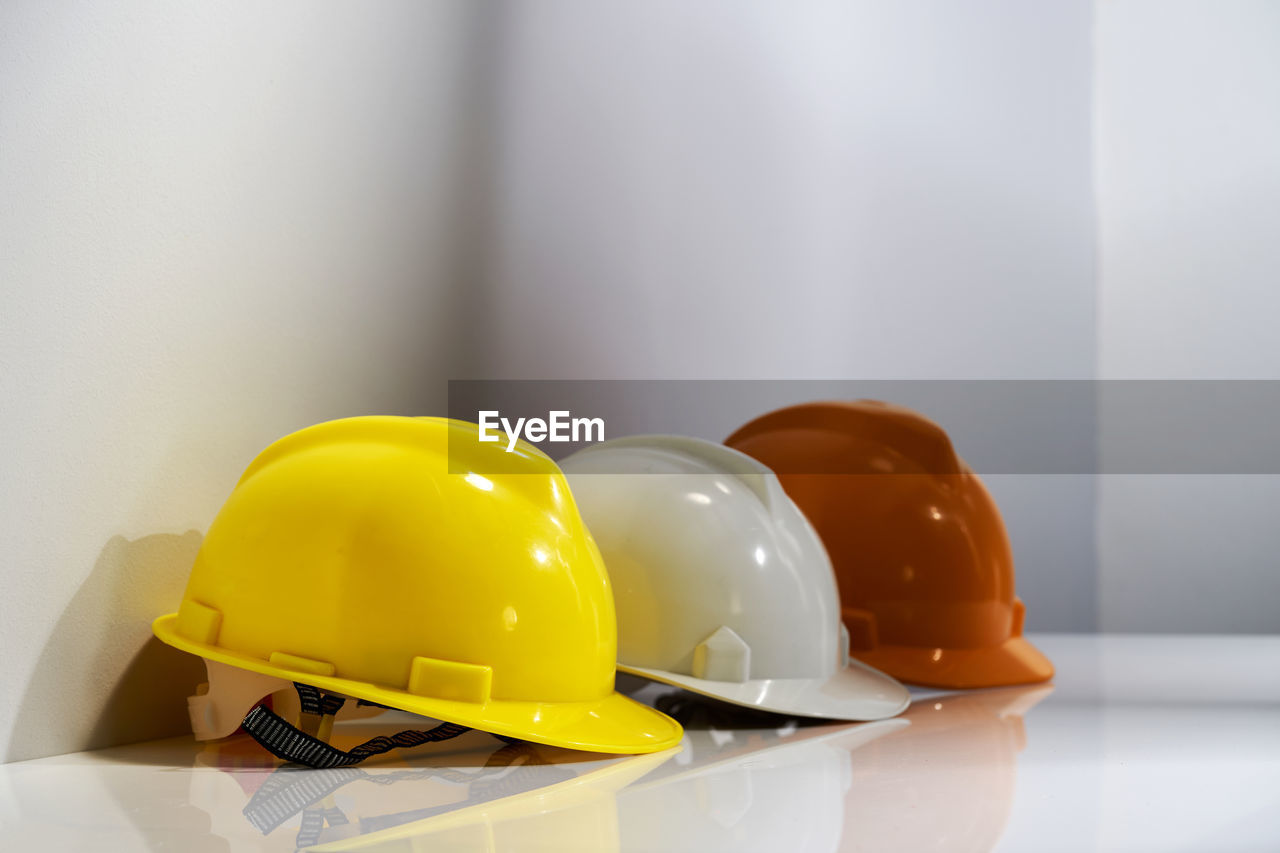 Different color of hard hat in a row