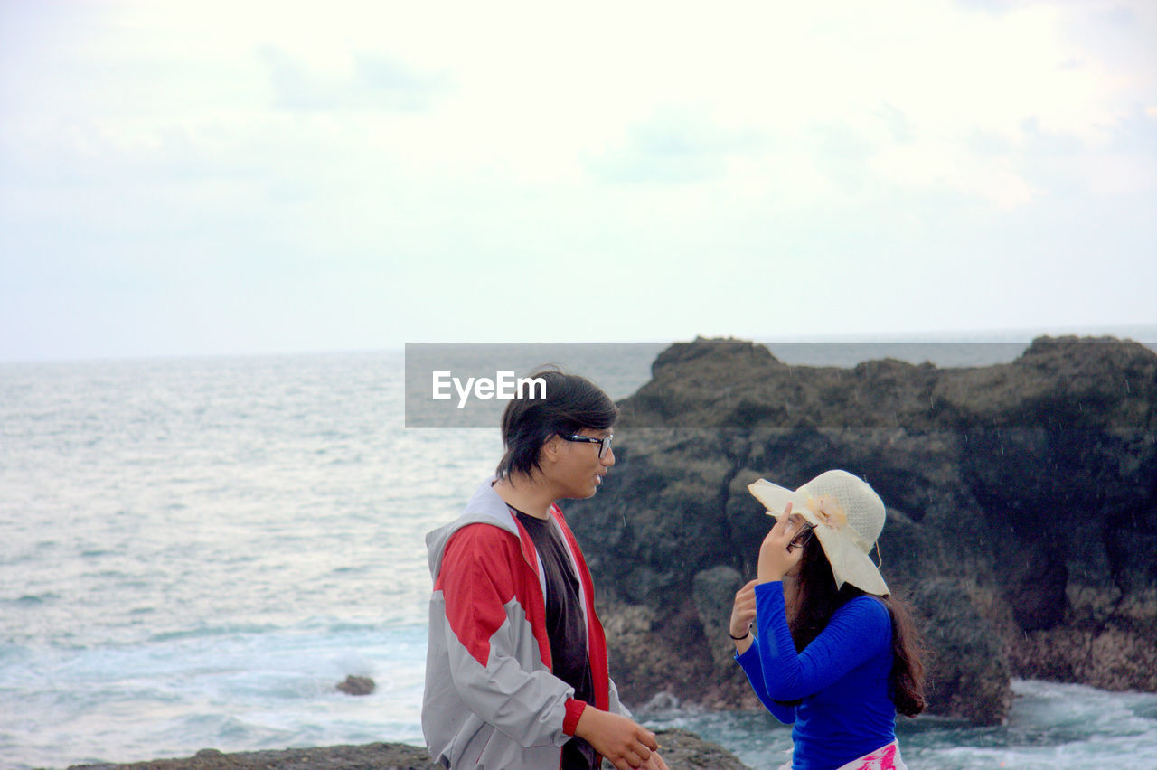 SCENIC VIEW OF SEA WITH TREES IN BACKGROUND